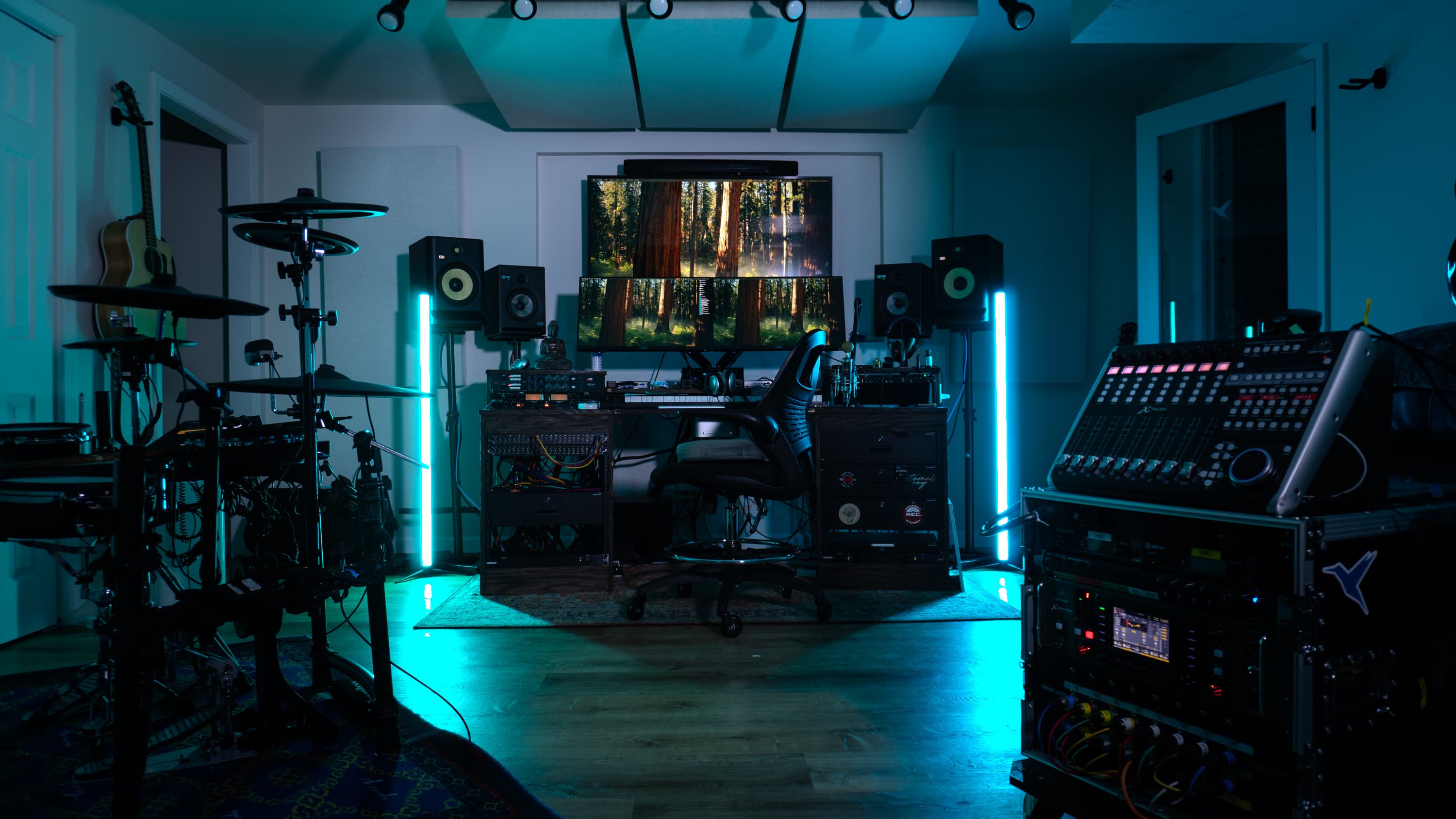 Pittsburgh recording studio with audio racks, mixing console and instruments