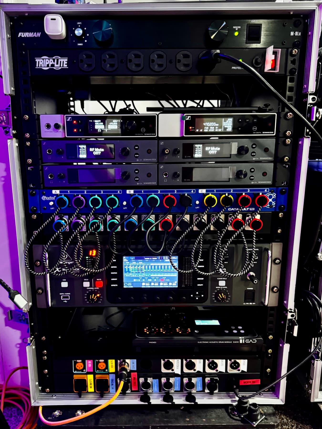 Front of Matt's live rack with wireless receivers, color-coded patching, digital mixer, and labeled power