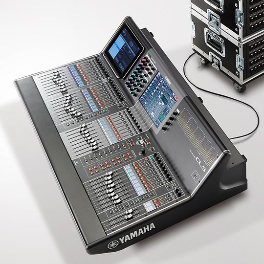 Yamaha CL5 — top three-quarter view of the console with rack case behind in a white studio